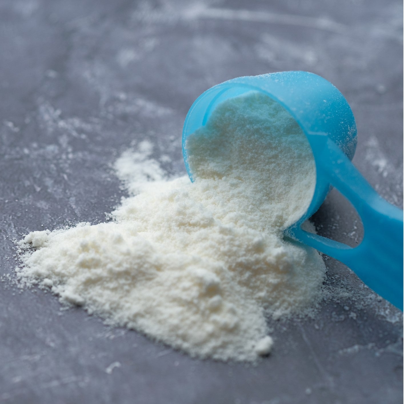 A scoop of Nido milk powder.